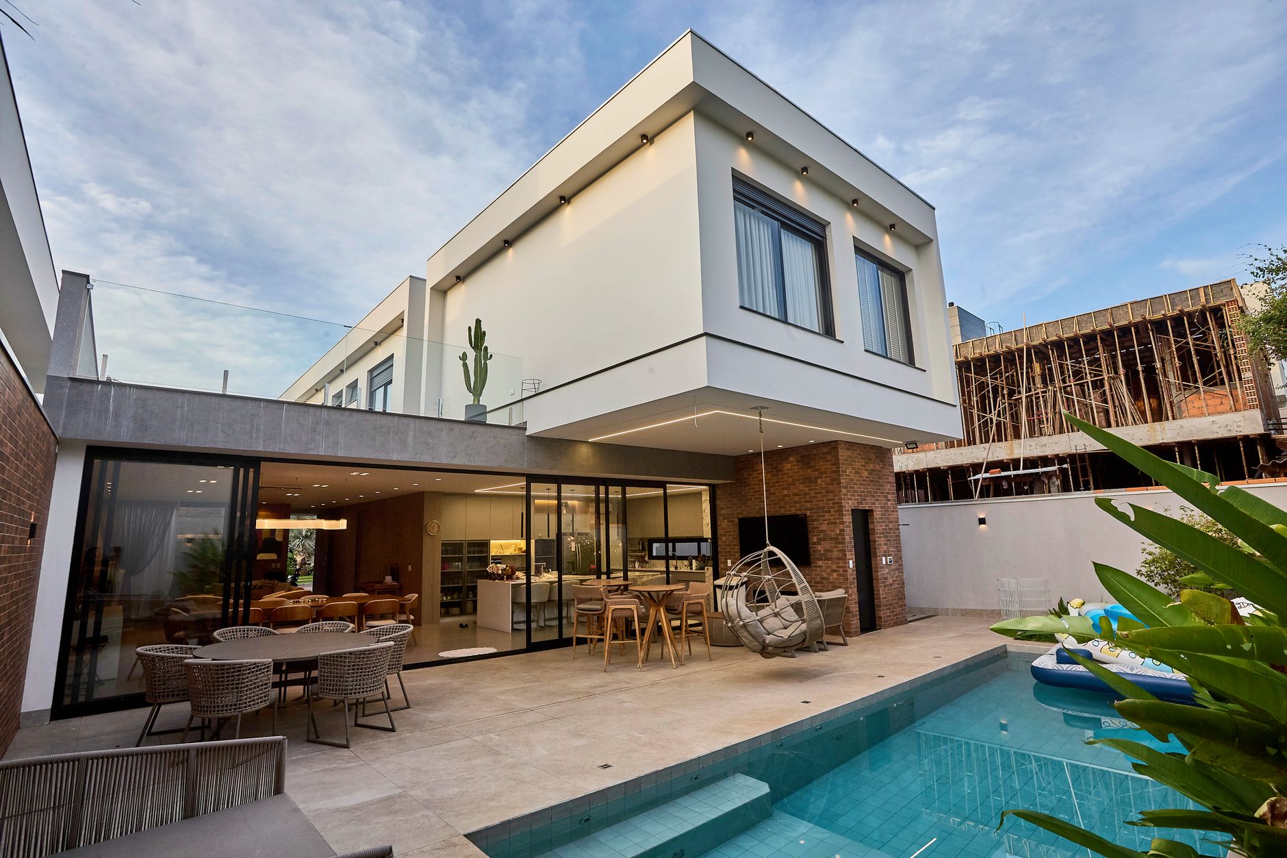 Contemporary luxury home with custom inground pool and outdoor living space