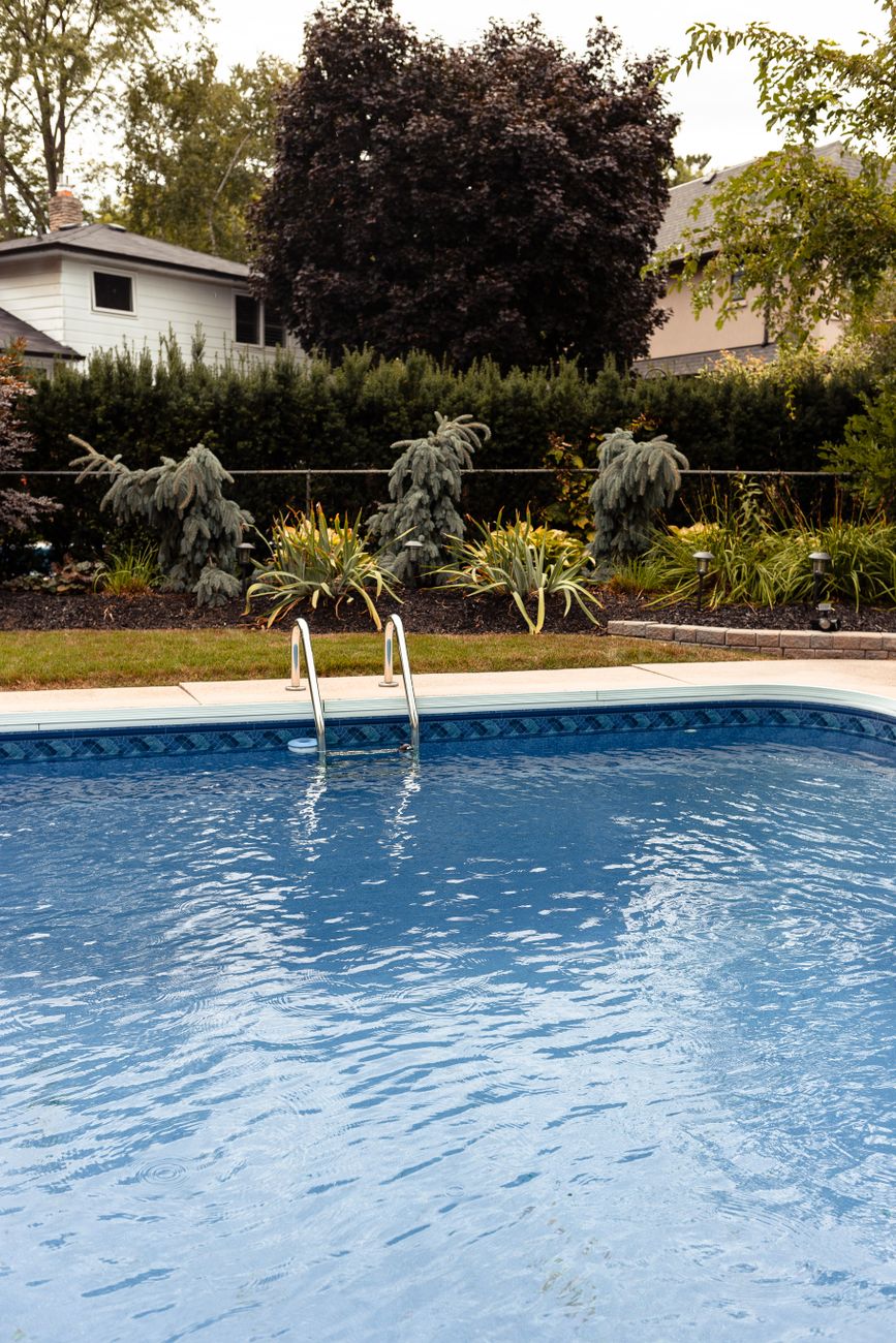 Crystal clear blue water in private inground pool
